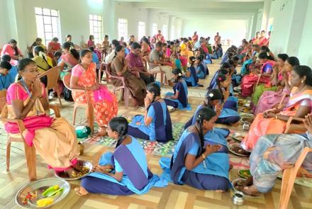 Students doing Paatha Pooja to their parents