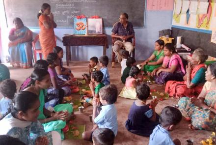 Students performing Paatha puja during Mathru Puja at Tenkasi