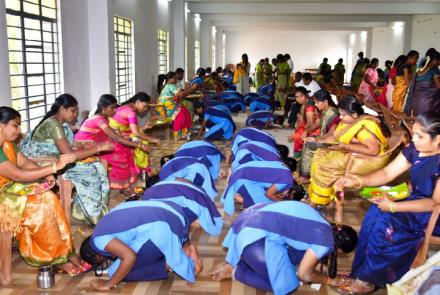 Parents blessing children during Matru Puja at VKV Vallioor